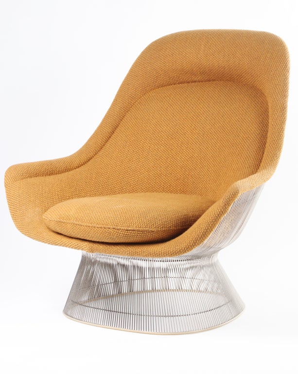 Iconic 1970s lounge chair designed by Warren Platner for Knoll in its original goldenrod-colored upholstery and chromed wire frame. Incredibly comfortable and in outstanding condition. Retains original Knoll tag beneath seat cushion.