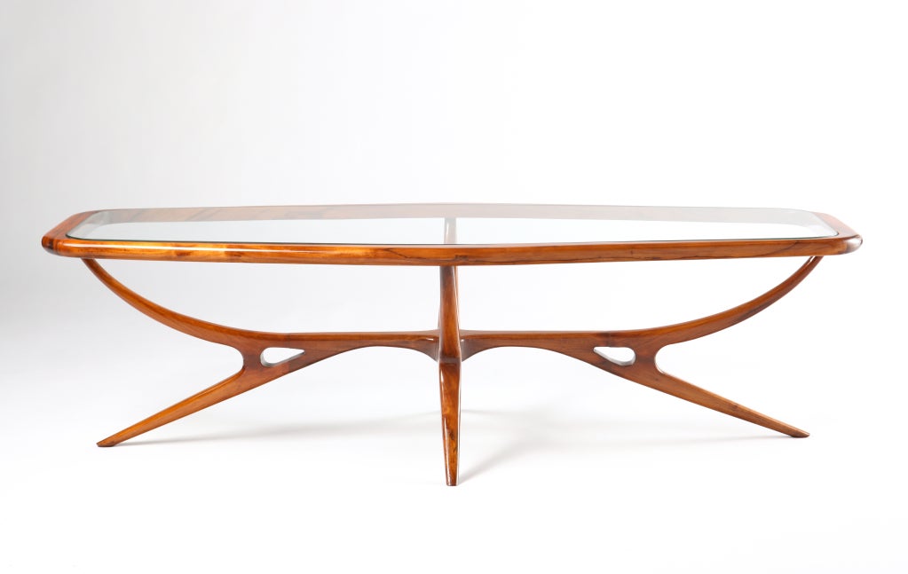 A cocktail table executed in solid Brazilian rosewood with an inset glass top circa 1950s, strongly attributed to Italian-born, Brazilian designer, Giuseppe Scapinelli - - the highly-architectural and sensual form clearly speaks to some of the best