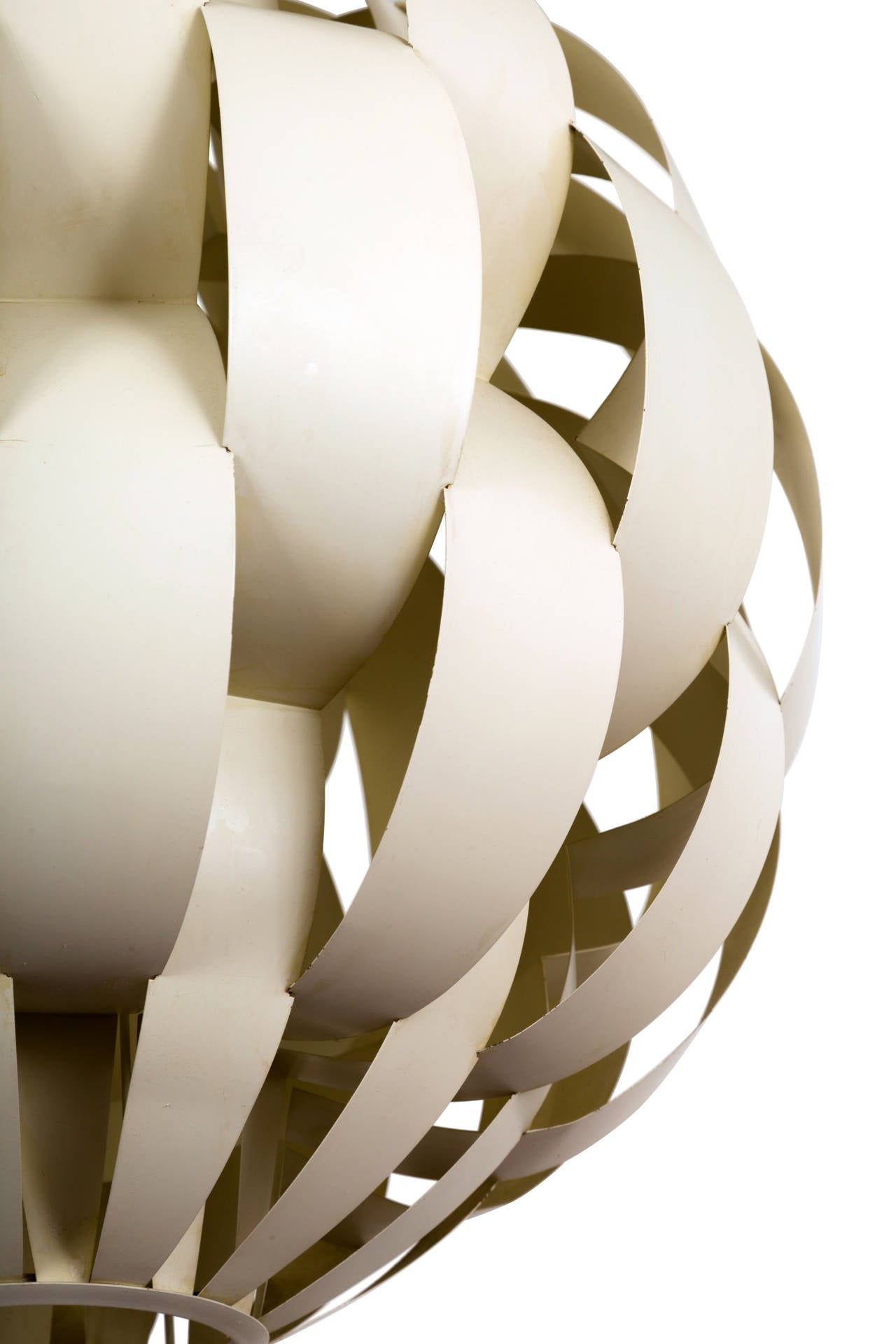 A large-scale, modernist chandelier by Lightolier comprising a spherical network of bent and folded strips of enameled sheet metal in a dramatic ribbon or basket weave design, much in the style of Max Sauze. Provides beautifully diffused light.