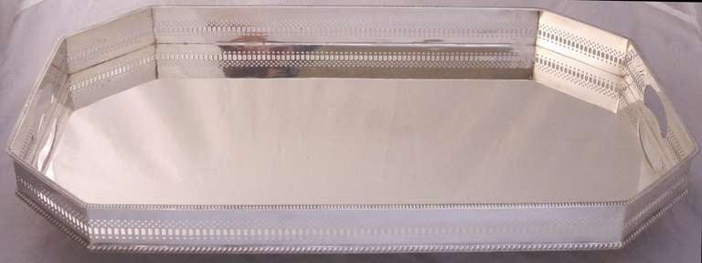 A handsome English rectangular eight-sided (octagonal) gallery serving tray with pierced gallery around the circumference.

We have similar gallery trays in a variety of styles and sizes - Please enquire