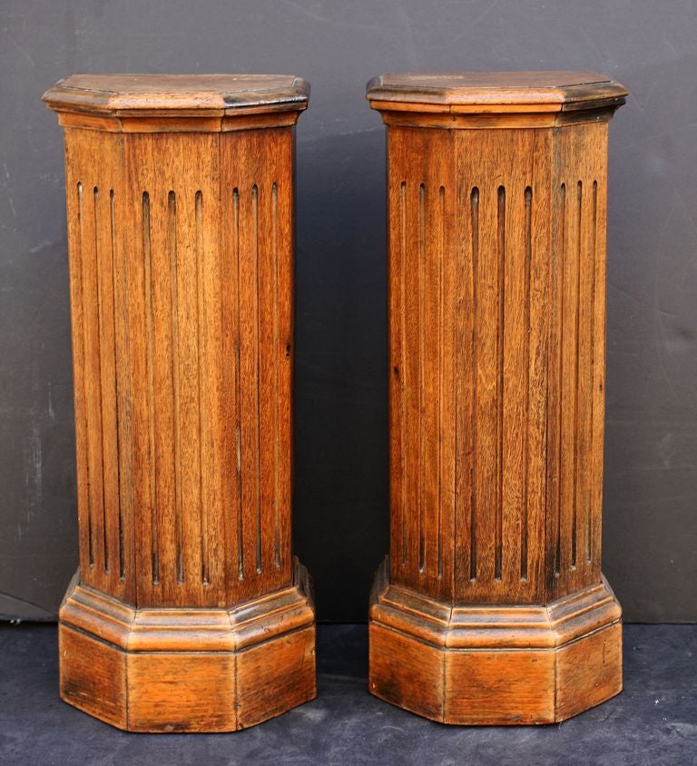 Handsome English plinths or pedestal stands of oak construction, featuring canted fronts in a classical column design.
Can also be hung or mounted on a wall.

One available, priced for individual sale: $895 each.
   