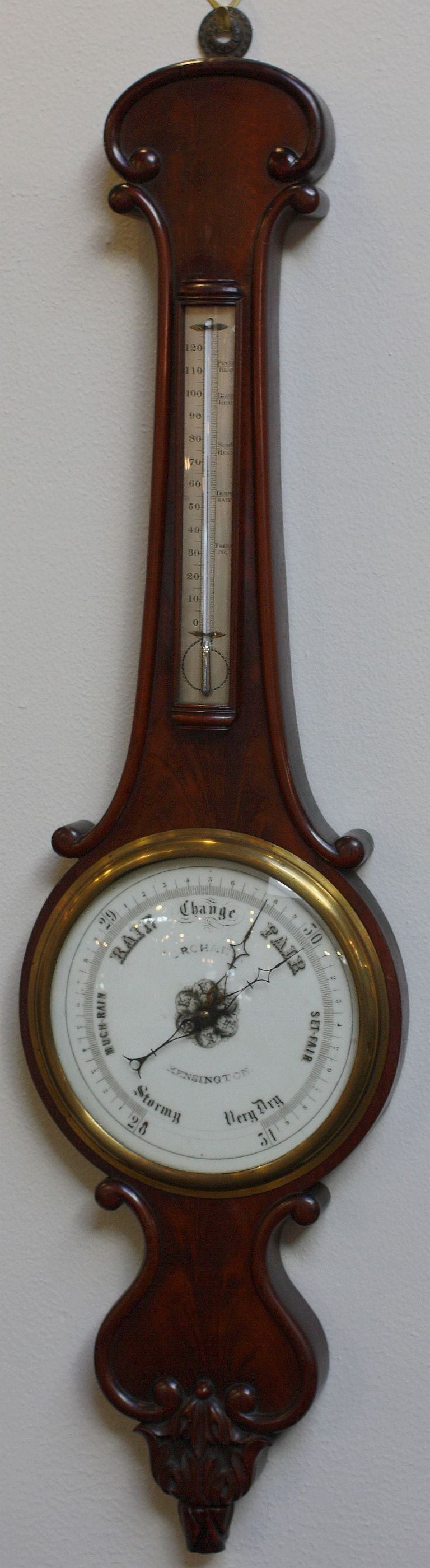 A working English banjo-shaped barometer of rosewood with porcelain dial and mercury thermometer by John Orchard, Kensington, with rare turn-nob dial set on case bottom 

J. Orchard, Kensington mentioned in The Official Descriptive and Illustrated