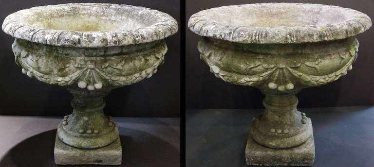 Pair of Large English Garden Stone Urns with Garlands of Fruit (Priced Individually)