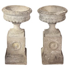 Pair of English Garden Stone Urns on Plinths