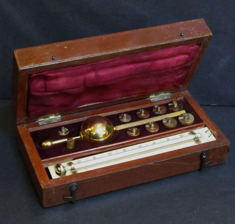 A boxed hydrometer (serial no.16234) with all parts, includes thermometer, ten weights and float, in fitted case.

Top plate marked: 