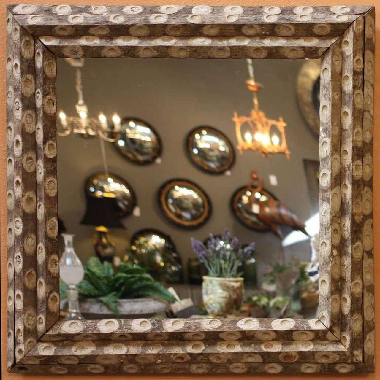 A large English oyster stick wall mirror, each featuring a square, canted frame of reclaimed oyster stick wood (used in the sea when harvesting oysters) around mirrored glass.

Dimensions: 32