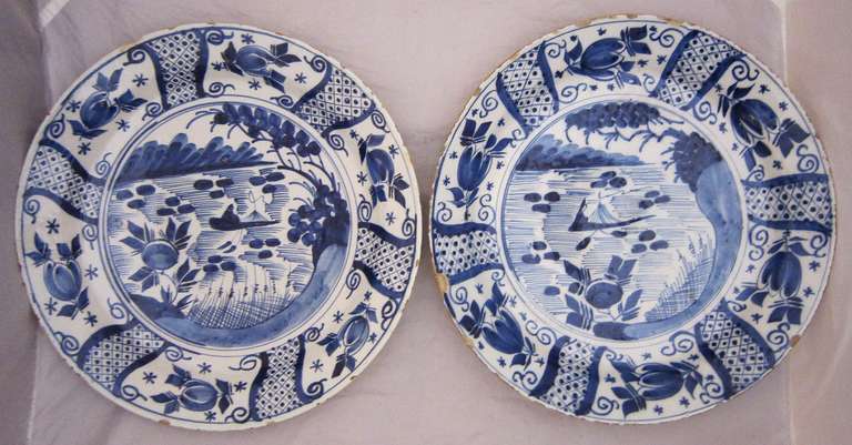 A pair of early 19th c. Dutch Delft blue and white glazed chargers (14