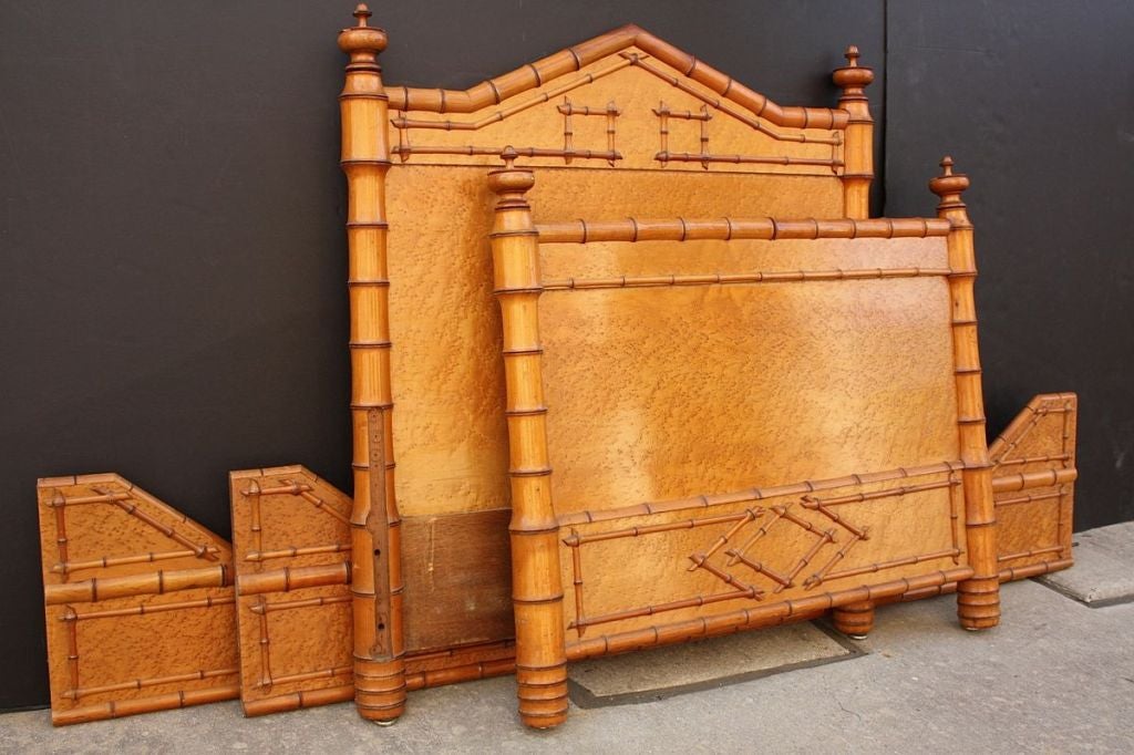 A faux bamboo bed featuring a curly maple headboard, footboard, and side rails with handsome, detailed faux bamboo turnings and ornamental finials.

Please Note: The outside dimensions of the bed are as follows:

Height 45