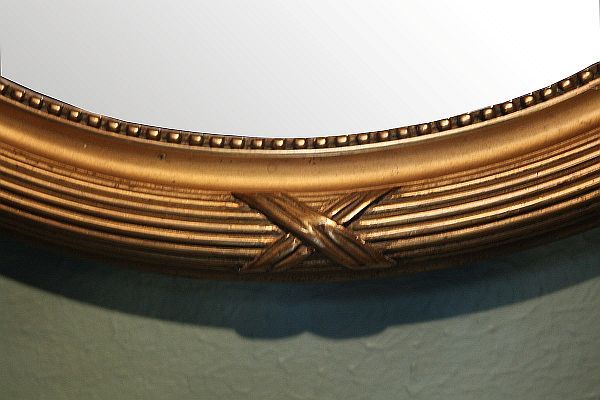 19th Century Pair of French Oval Gilt Mirrors with Ribbon Design