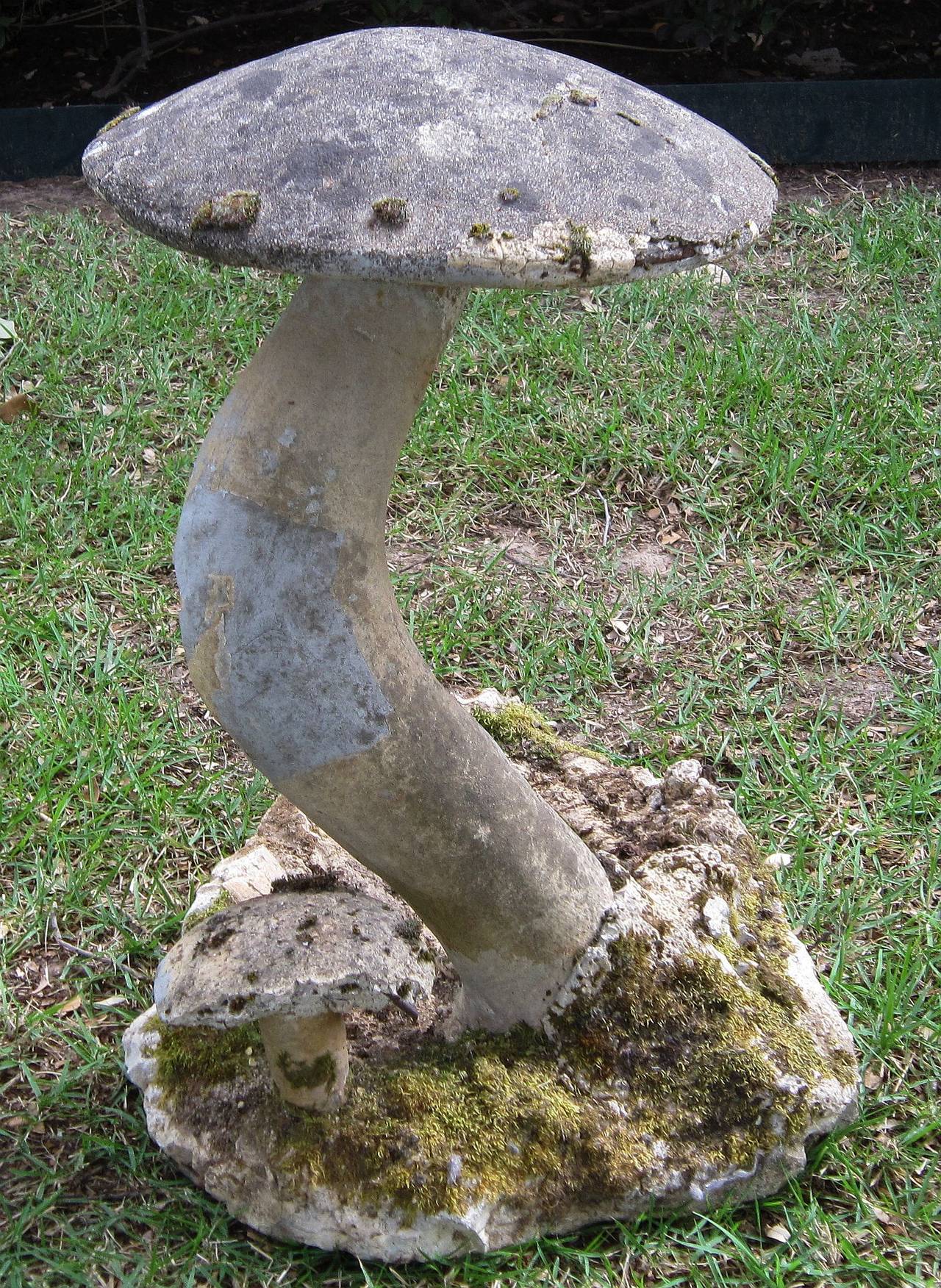 A handsome French garden stone grouping of naturalistic fungi. 
Of cast or composition stone, this grouping features expertly modeled toadstools or mushrooms in a natural setting.