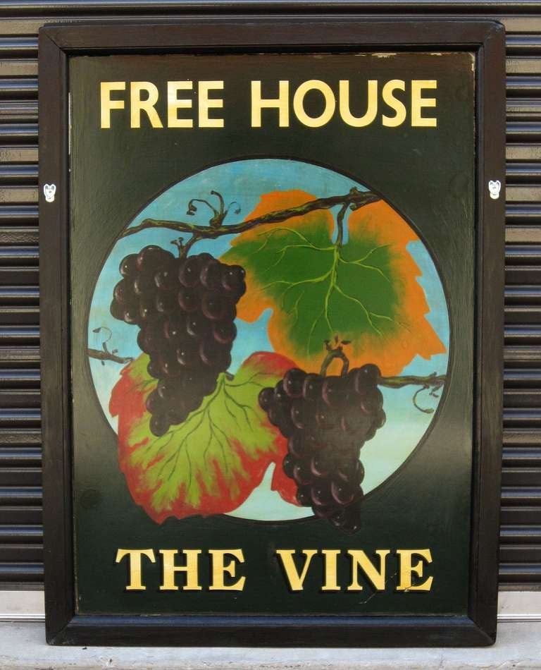 An authentic English pub sign (two-sided) featuring a painting of grape clusters on a vine, entitled: The Vine (Free House).

A free house in Great Britain is a public house that is not controlled by a brewery and so is free to sell different
