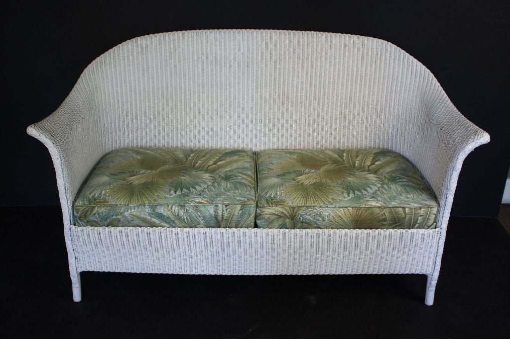 A Lloyd Loom sofa, synonymous with classic English style.<br />
Perfect for the Garden Room or Conservatory, this sofa features the vintage look and comfort one only finds in the original, pre-War series. A flowing, serpentine back of woven wicker