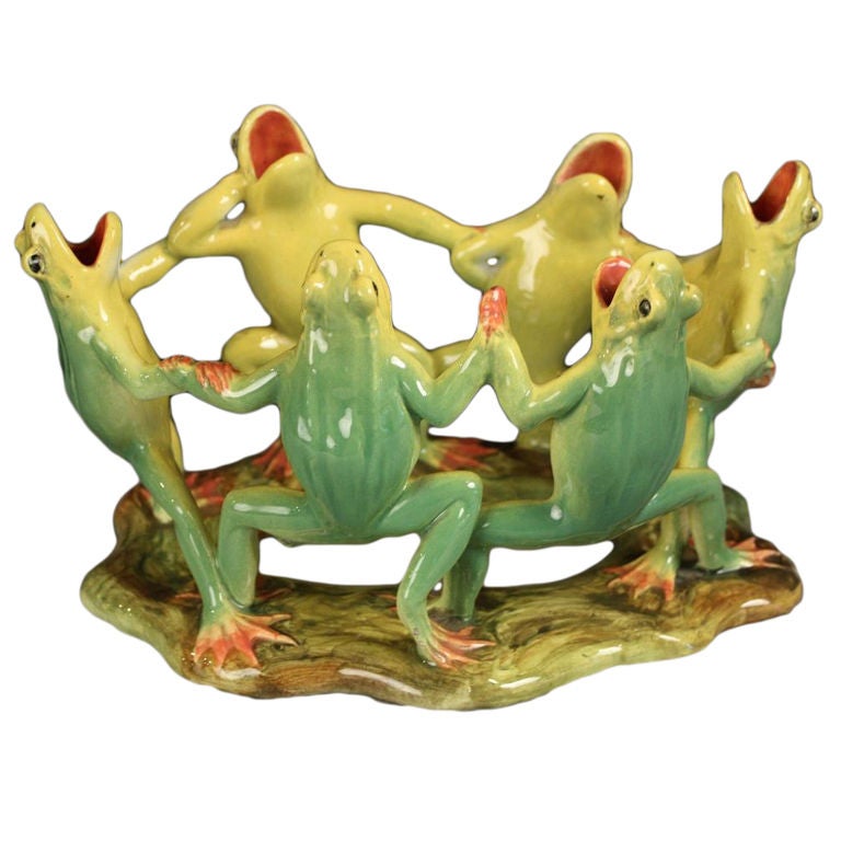 Art pottery majolica from Art Nouveau-era France by the celebrated firm in Vallauris, Delphin Massier.

A wonderfully-designed centerpiece featuring a group of six standing frogs in an embrace and dancing in a circle. 

Crafted and hand painted