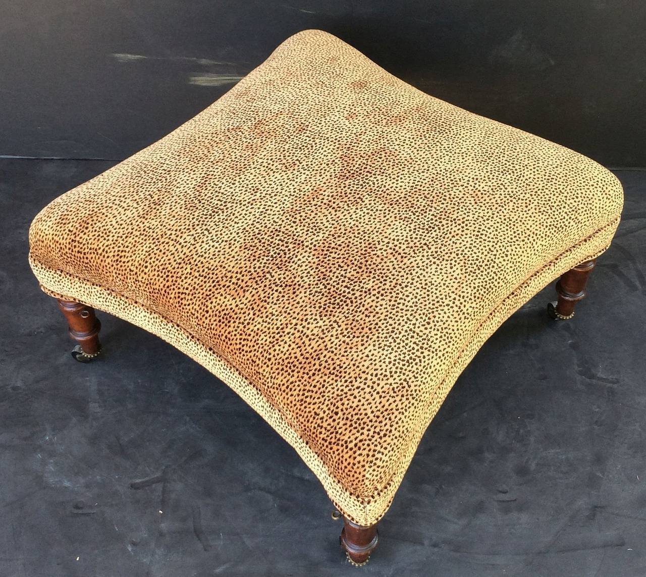 English Upholstered Ottoman on Mahogany Legs 1