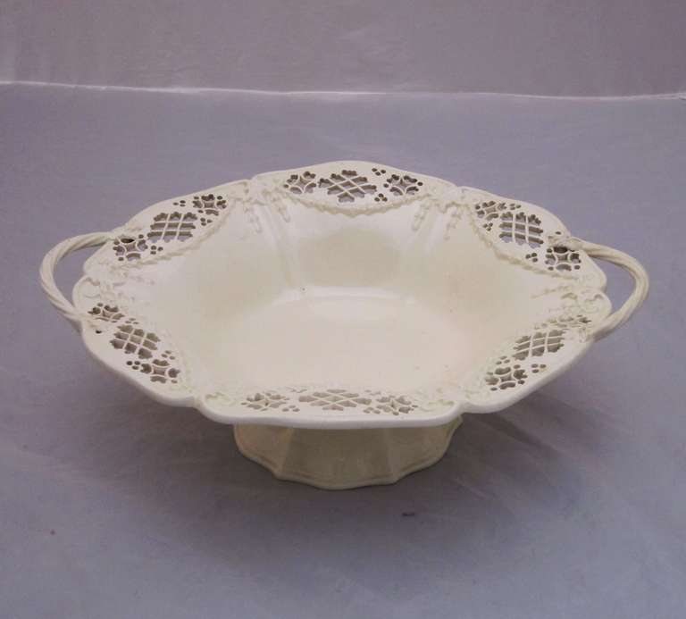 A fine pierced cream ware (or creamware) compote (or comport) from the Georgian era  -  a footed oval bowl with a design of raised swags and a raised feather edge around the circumference. Leeds Pottery was established in 1758 at Jack Lane, Hunslet,