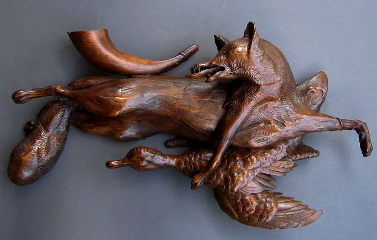 A huntsman's trophy in the Old World style!

A hunter's wall plaque of carved wood from Europe featuring a relief carving of a fox and duck, with hunting horn.

Perfect for a game hunter or sportsman's club room or office or for your very own