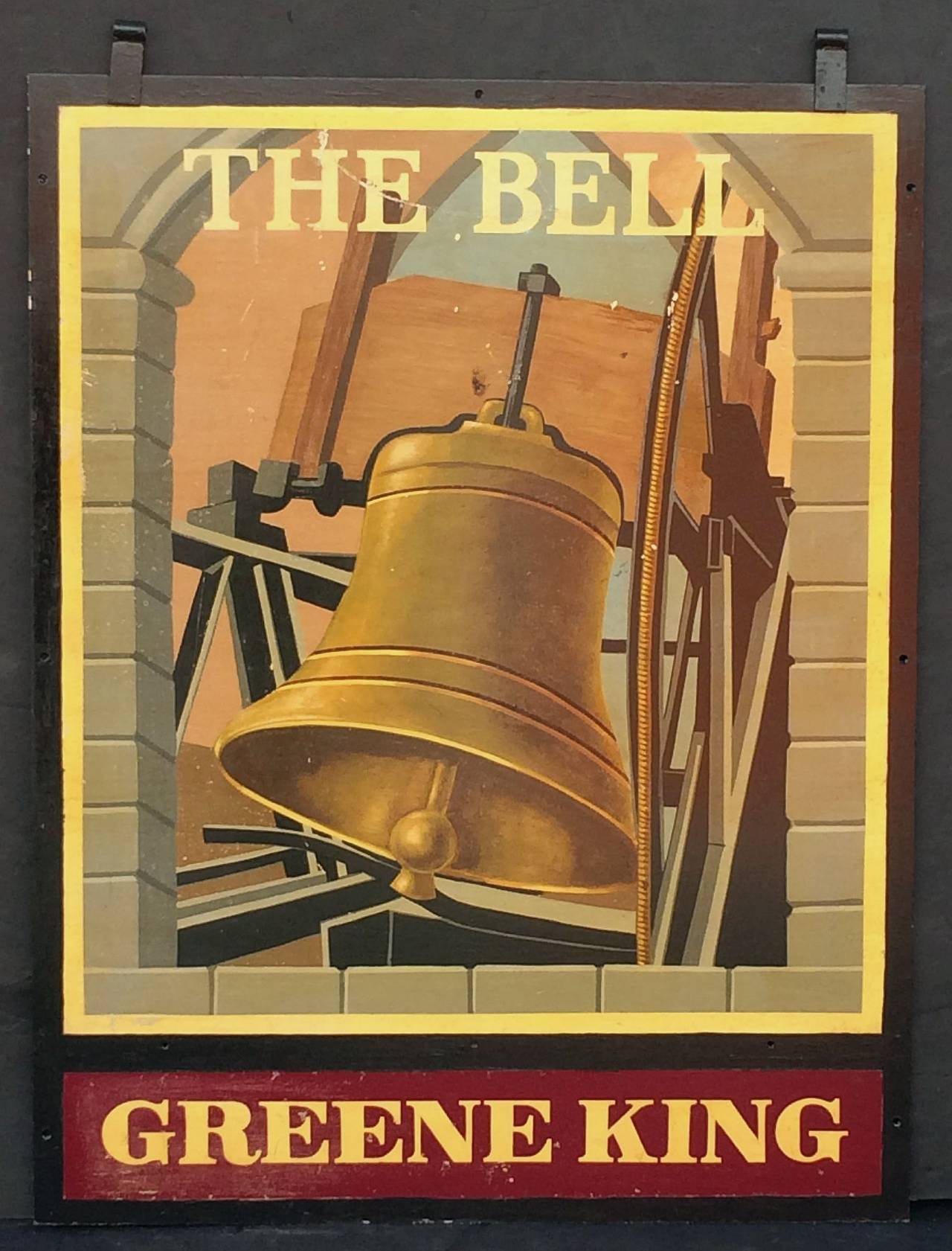 An authentic English pub sign (two-sided) featuring a painting of a tower or church bell ringing, entitled: The Bell, from an original Greene King pub.

Marked: Greene King (Greene King is a British brewery established in 1799 in Bury St Edmunds,