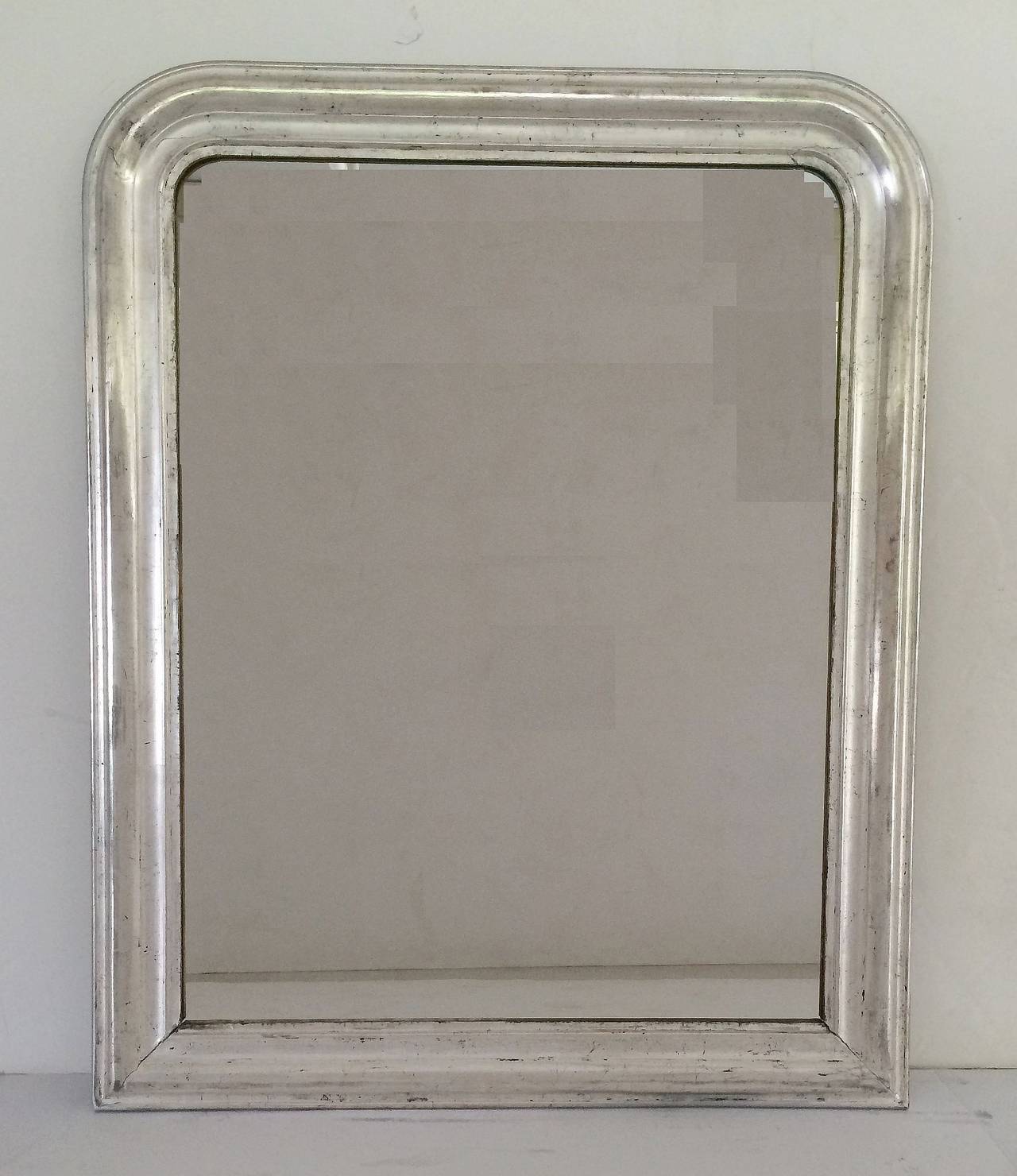 A handsome large Louis Philippe wall mirror featuring a moulded surround with silver-leaf overlay.

Dimensions: H 44 inches x W 35 inches

Other sizes available in this style.