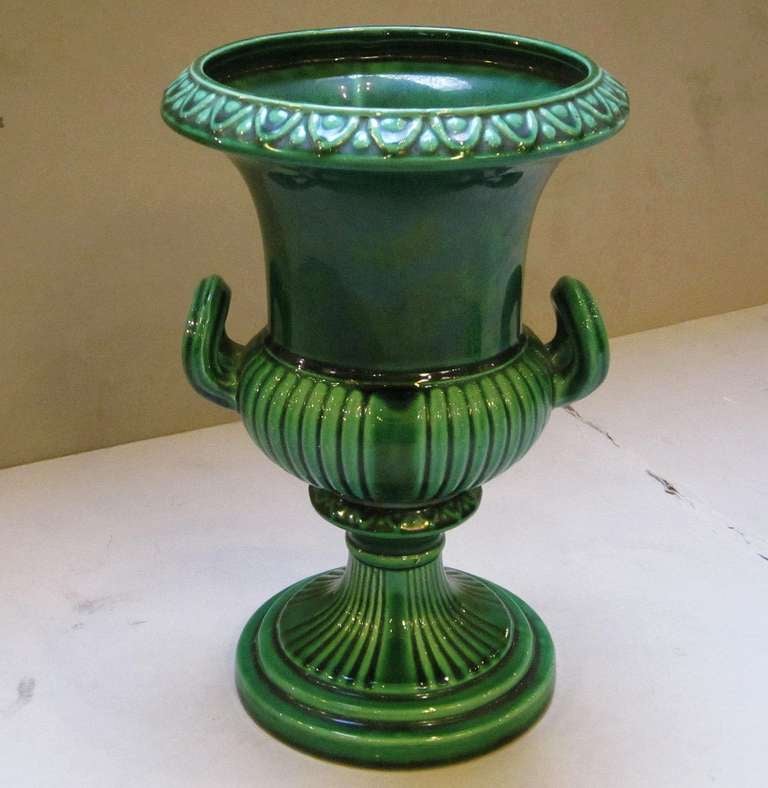 A fine English green-ware Majolica vase featuring a green glaze 
over a Classical style urn body.

By the Dartmouth Pottery in Devon, England.

There are two similarly styled vases available.
Individually priced: $395 each
