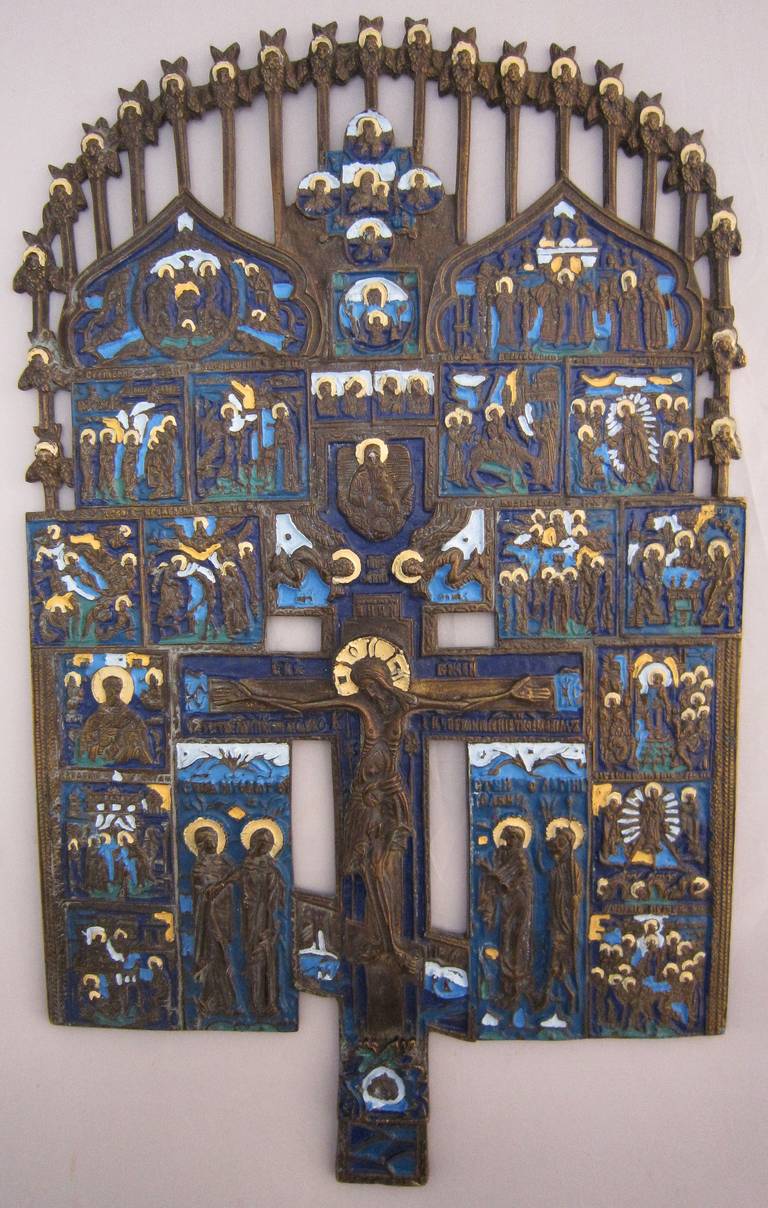 A Russian orthodox icon of enameled bronze, modeled as a hanging panel for traveling pilgrims and priests to set up for prayers and reflection. Note crucifixion in center.