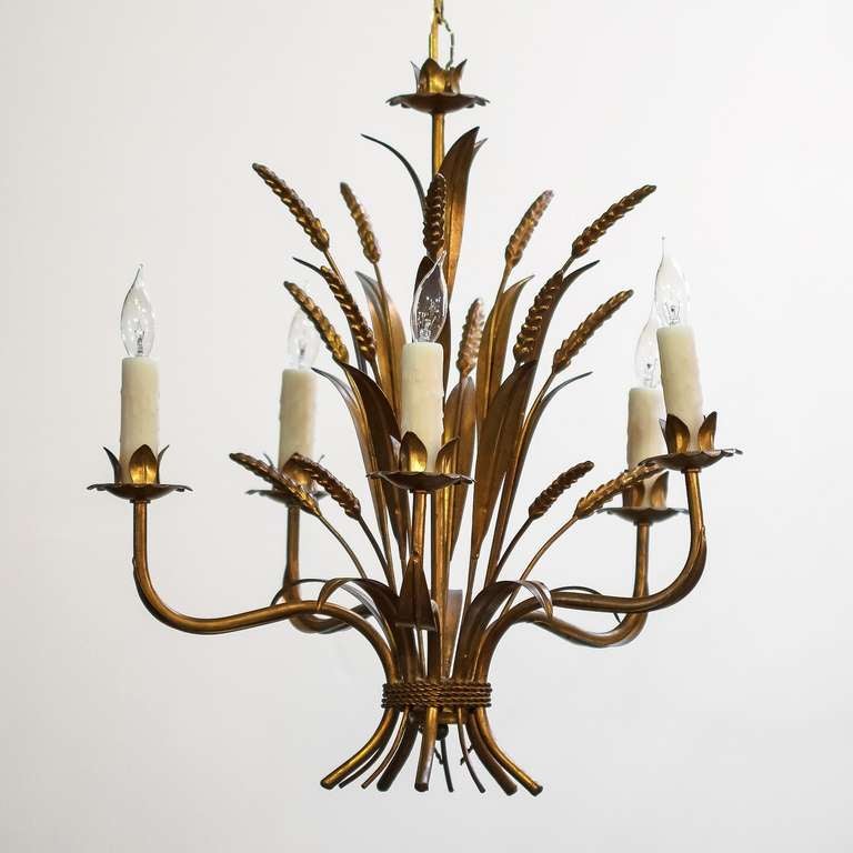 A handsome French five-light hanging fixture or chandelier of gilt metal with a wheat sheaf design, featuring five serpentine arms with candle lights, surrounding a center column of wheat stalks and leaves.