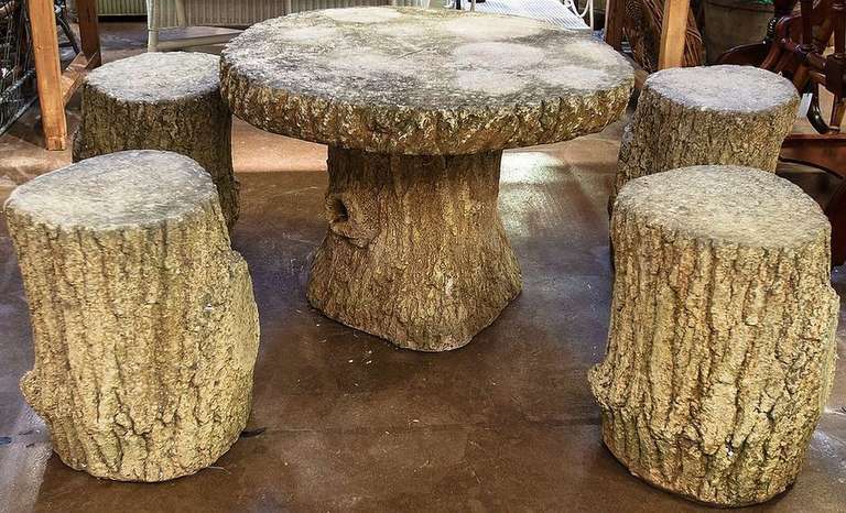 A lovely French Faux Bois garden stone set (includes table and four stools) - each piece featuring a naturalistic relief design of a tree trunk.

Table dimensions:  H 21