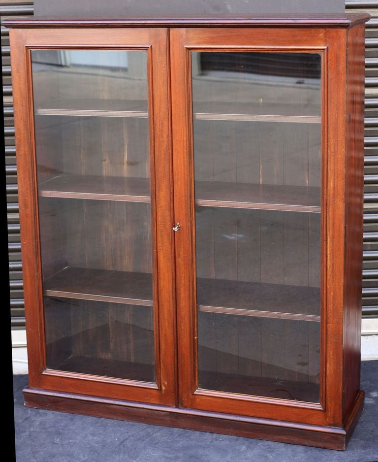 English Standing Bookcase of Mahogany with Glazed Doors In Excellent Condition In Austin, TX
