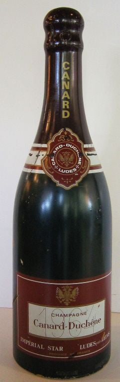 A large French champagne wine bottle of painted fiberglass, used as an advertising prop. (H 39