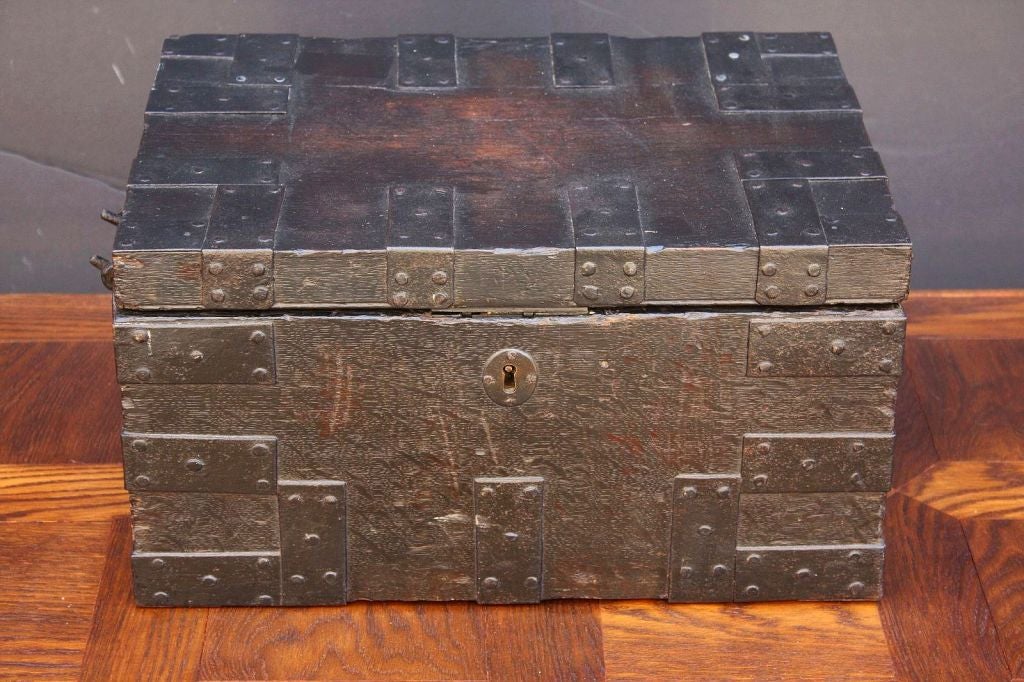 A handsome English iron-bound bullion (or strong) box of oak with key.
Featuring a locking interior of iron with removable iron plate.