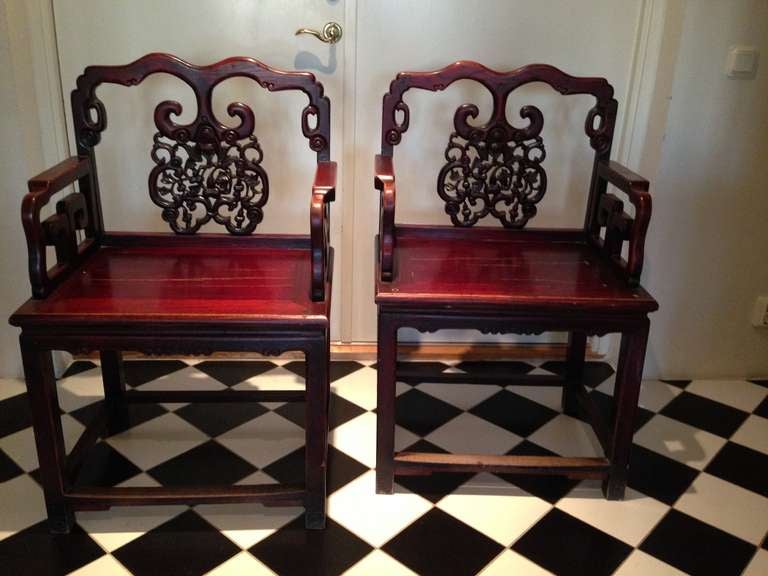 A pair of Chinese Rosewood wedding armchairs.