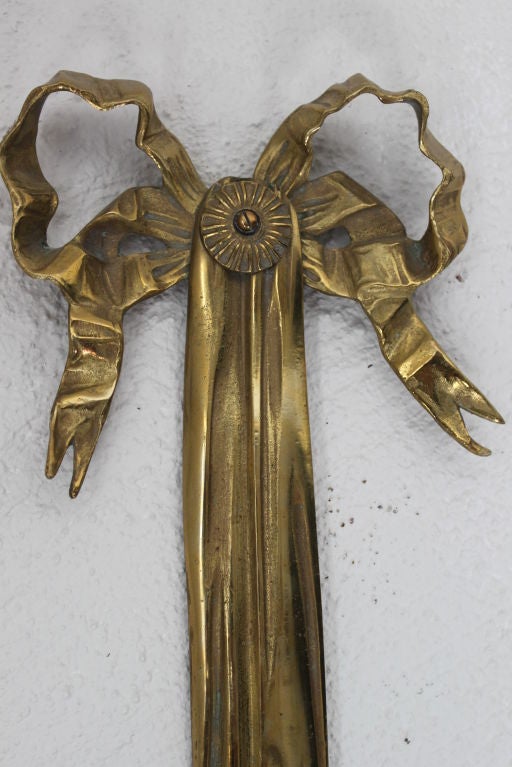 Wall Sconce Large French Gilt Bronze Empire Style France. A wall sconce in a large size made in France during the early 20th century in gilt bronze. Electrified with two arms for candelabra bulbs. Need rewiring for US light. 