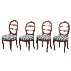 A Set of Four Side Chairs "Laughing Chair" 11