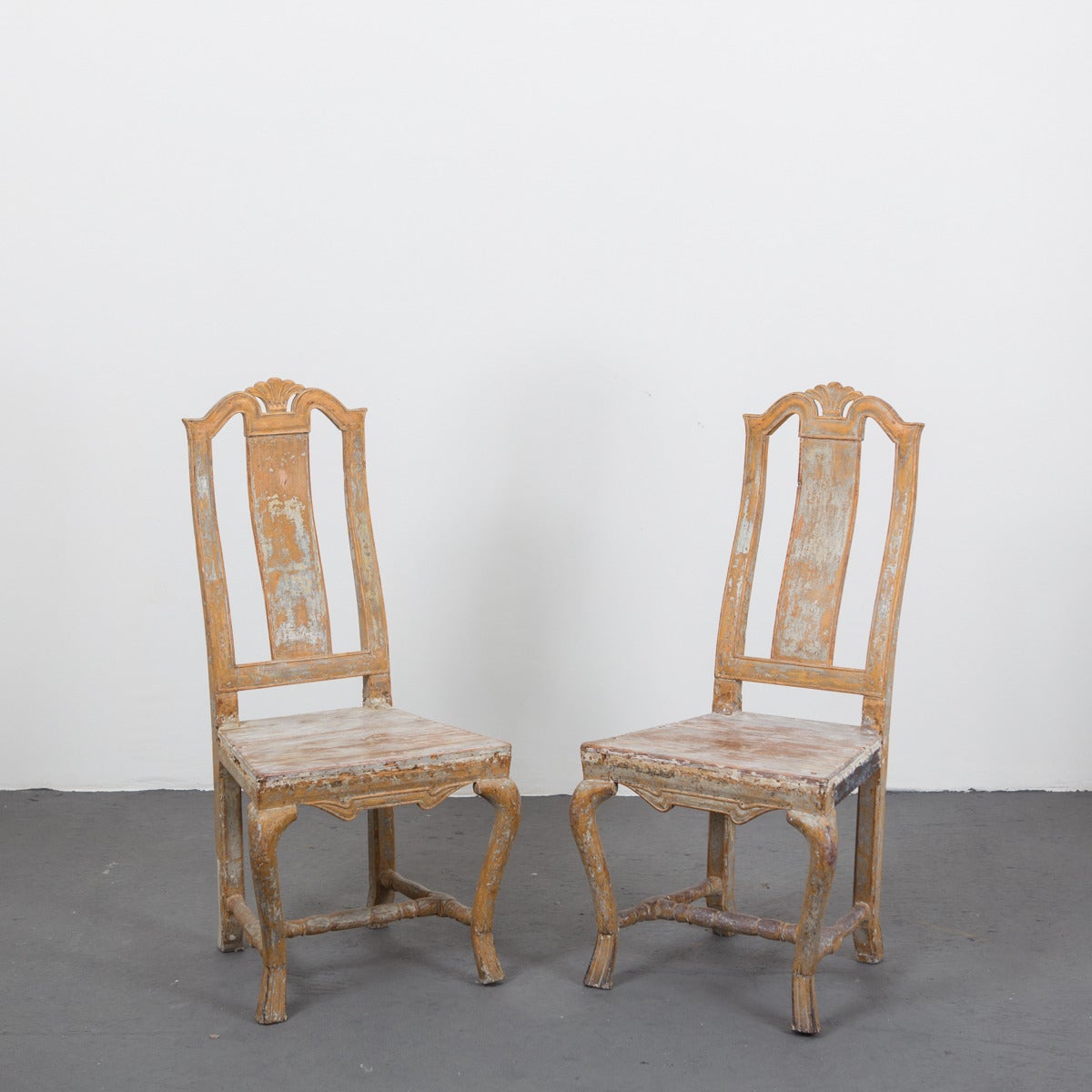 Pair of Swedish side chairs made during the Baroque period 1650-1750. Original paint and carvings.