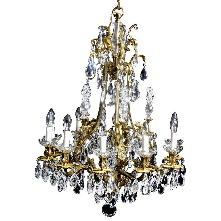 Chandelier Swedish Rococo Style 19th Century Sweden. A large chandelier made during the 19th century in Sweden. Cage made from brass with crystal prisms. Wired for electricity. 