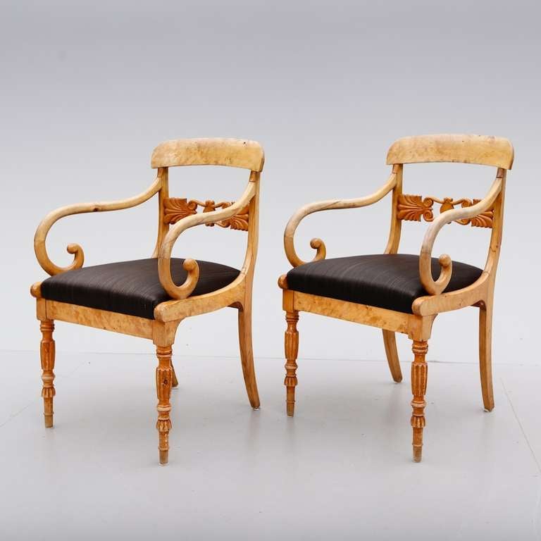 A pair of Swedish Biedermeier armchairs in light birch made during the mid 19th Century ca 1840. 