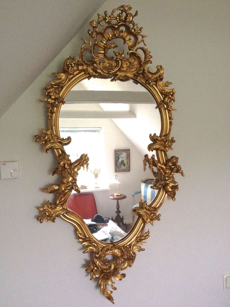 A beautiful wall mirror made during the late 19th century in the Rococo style.