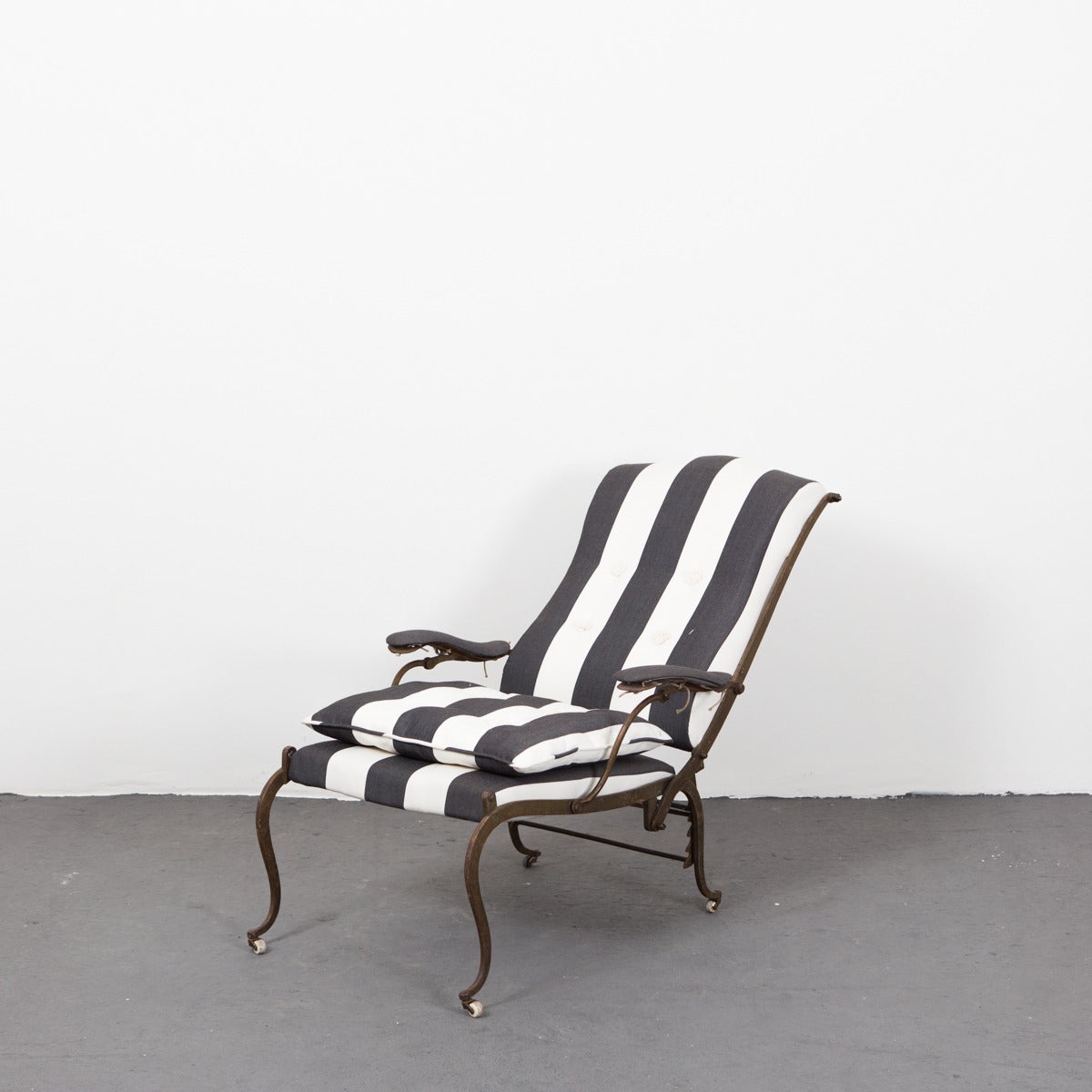 Chair made in Sweden during 19th Century in iron. Back adjustable in 4 modes. Upholstered in a black and white wide striped thick cotton canvas.
