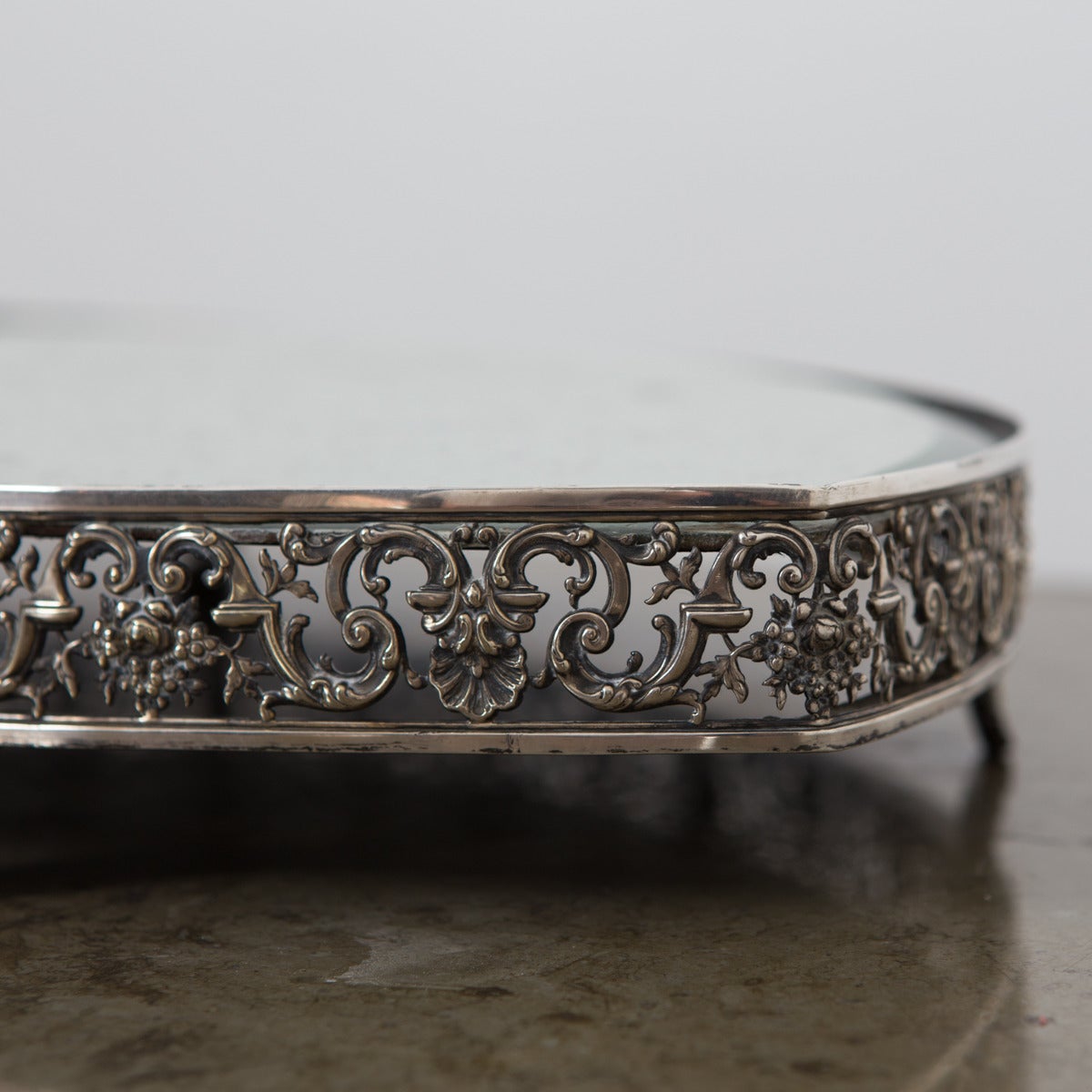 A almond shaped centre piece from France made during the Empire period early 19th Century. Made in silver plate. Frieze decorated with leaves and flowers. Feet in shape of leaves significant for the Empire period.