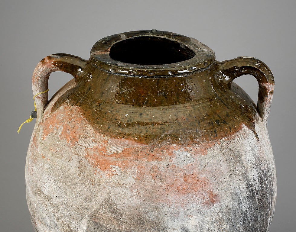 Semi glazed pottery urn made in southern Europe during 19th Century.