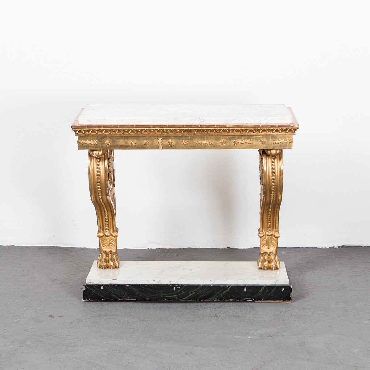 Table Console Swedish Gilded Carrara Marble Top Empire Neoclassical Sweden. A Karl Johan console table made during the Karl Johan period, circa 1810 in Sweden. Gilded wood with carvings typical for the period. Legs ending with lions feet. Top made