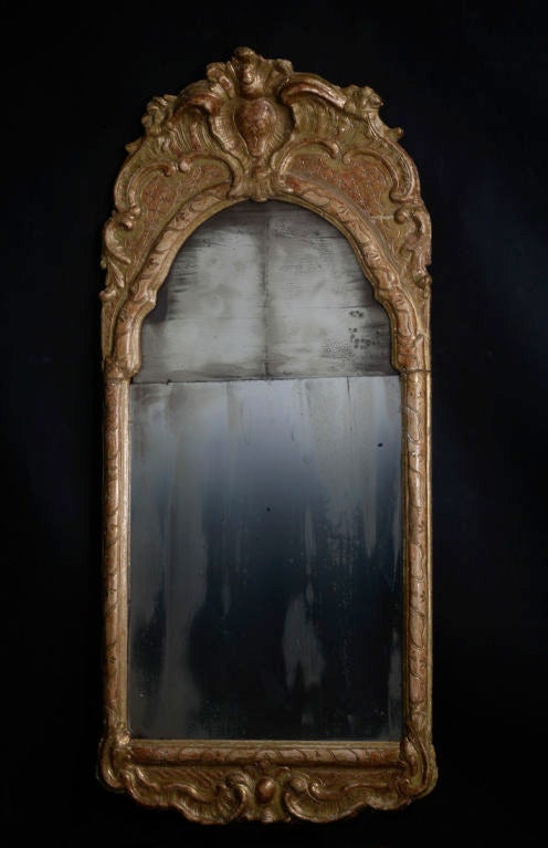 A Swedish late baroque/early Rococo mirror in giltwood.