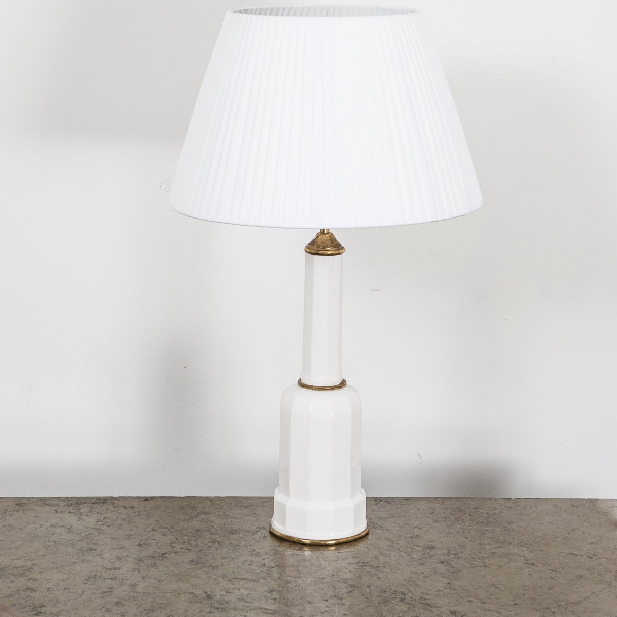 Table lamps in porcelain and brass, made during the 20th century.

Height is 19.5