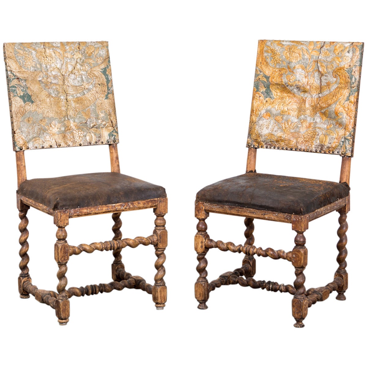 Chairs Pair Swedish Baroque Period 18th Century Sweden. A pair of exquisite side chairs made in Sweden during the Baroque period 1650-1750. Original gilt leather on the back splat. Straight frame on serpentine legs with a serpentine foot cross.