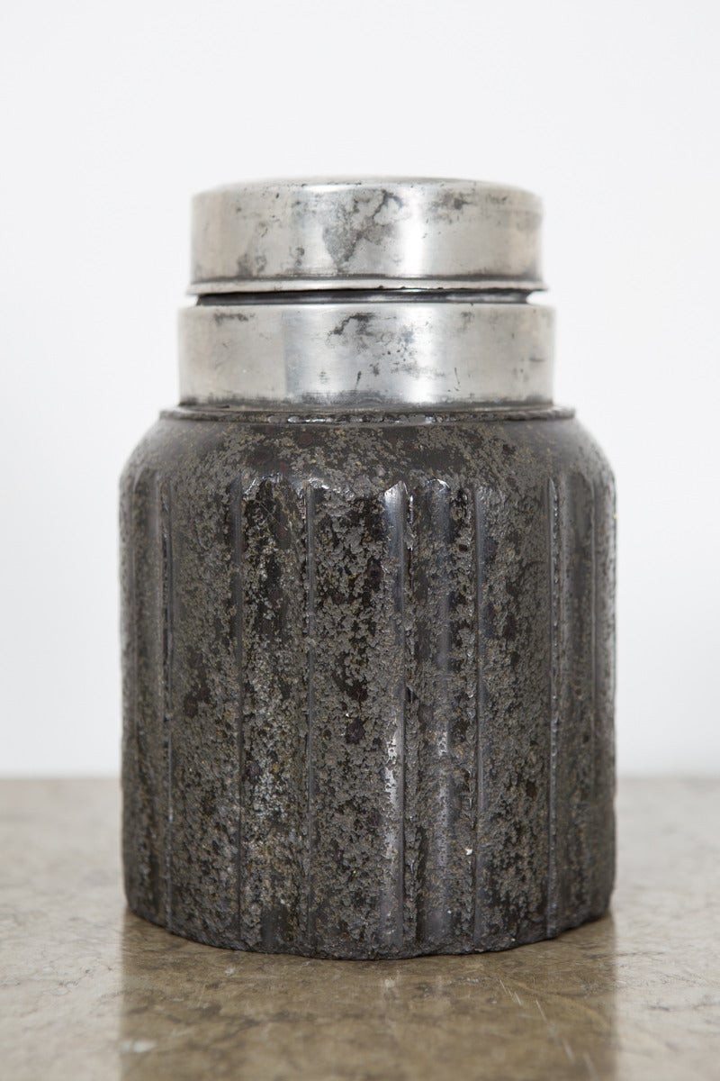 A rare object made in dark stone with a polished pewter lid. Stone is cylinder shaped with channels. Made in Sweden during the 17th Century.