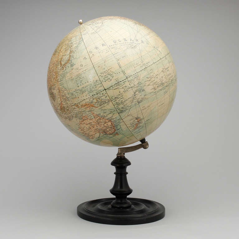 World globe standing on a black painted stand. Made early 20th Century.