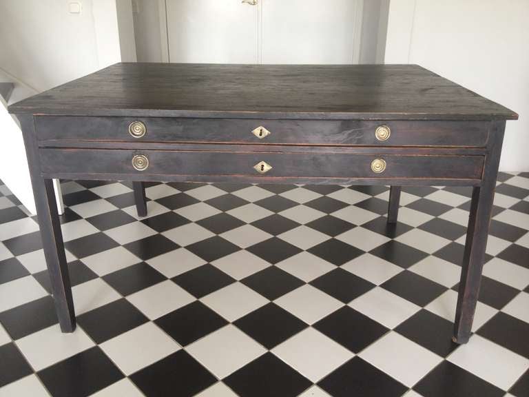Am unusually large Swedish desk made during the Gustavian period ca 1775-1790. Repainted in soft distressed black . 2 long working drawers. Original hardware.
Apron height: 8 in
Height to apron: 22 in
Top: 1 in thick
