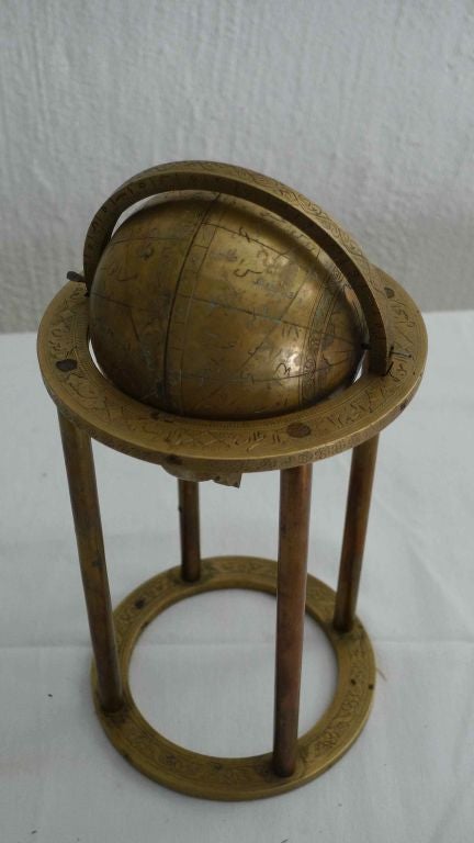 A Persian celestial globe with Farsi inscriptions.