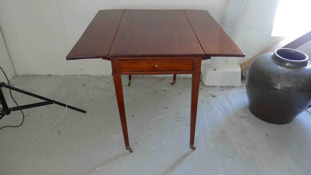 A Swedish drop leaf table made in Mahogany. Drawer on side.