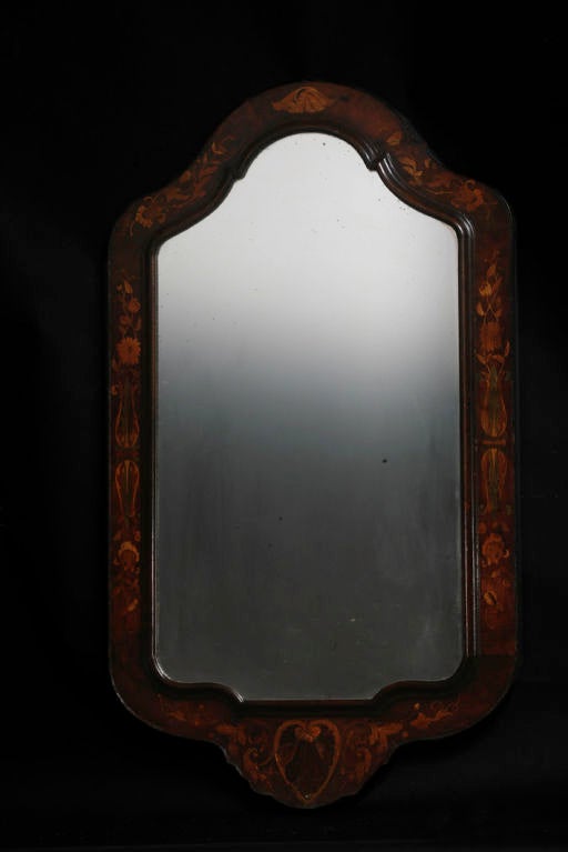 Mirror wall Dutch baroque original condition inlays, Netherlands. A mahogany wall mirror made during the 18th century in Holland. Frame with colored detailed inlays such as shells, Rocaille, acanthus leaves. Original condition.