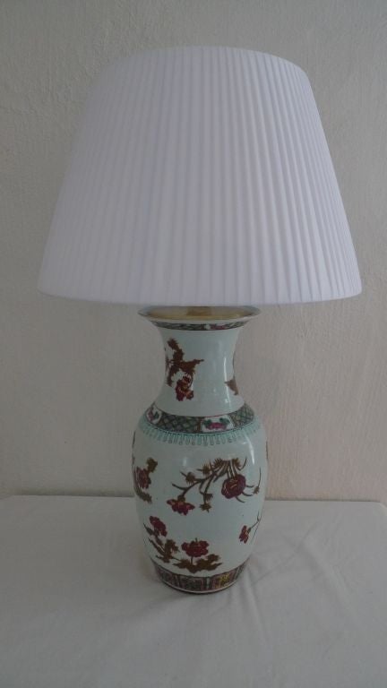 A table lamp made from a Chinese 19th Century Famille Rose vase. Early 19th Century. the diamter of 8 inches refers to the vase. Shade is 16.5 in